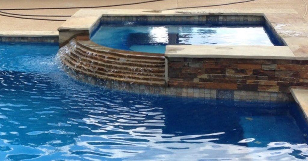 Benefits of Adding a Spillover Spa to Your Custom Pool